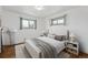 Cozy bedroom with ample natural light, hardwood floors, and neutral decor at 235 N 12Th Ave, Brighton, CO 80601