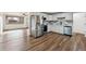 Modern kitchen featuring stainless steel appliances, white cabinetry, and sleek countertops at 235 N 12Th Ave, Brighton, CO 80601
