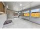Enclosed patio features multiple windows, access stairs, and modern lighting at 235 N 12Th Ave, Brighton, CO 80601