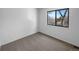 Bright bedroom with a large window offering natural light and a minimalist aesthetic at 10248 Quivas St, Thornton, CO 80260