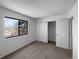 Comfortable bedroom featuring a large window and a closet for ample storage at 10248 Quivas St, Thornton, CO 80260