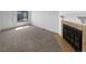 Bright living room boasting a fireplace and neutral tones, perfect for comfortable living at 10248 Quivas St, Thornton, CO 80260