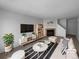 Bright living room with cozy fireplace, modern furniture, and stylish decor at 10248 Quivas St, Thornton, CO 80260