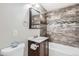 Updated bathroom features a modern vanity, decorative tile shower, and new fixtures at 1248 Moline St, Aurora, CO 80010