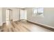 Bedroom with wood-look flooring, neutral walls, and a bright window for natural light at 1248 Moline St, Aurora, CO 80010