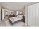 This bedroom boasts a large bed, ample closet space, and plenty of natural light at 1248 Moline St, Aurora, CO 80010