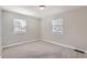 Empty bedroom with neutral paint, plush carpet, natural light, and a window at 1248 Moline St, Aurora, CO 80010