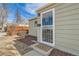 Close-up of a front door showcasing a security screen and a decorative welcome mat at 1248 Moline St, Aurora, CO 80010