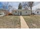 Inviting single-story home with a tidy front yard and concrete walkway, creating a welcoming entry at 1248 Moline St, Aurora, CO 80010