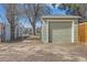 This image displays a detached garage with a security gate, offering private parking and security at 1248 Moline St, Aurora, CO 80010