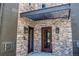 Exterior shot showcasing stone building entrance with multiple entryways at 920 Eudora St # 201, Denver, CO 80220