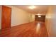 Unfinished basement with wood-look floors and unique stone accent wall. Ready to be styled! at 8750 Rutgers St, Westminster, CO 80031
