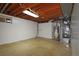 Unfinished basement area with exposed ceiling beams, concrete floor, and mechanical systems at 8750 Rutgers St, Westminster, CO 80031