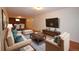 Stylized basement features wood-look floors, stone accent wall, and comfortable living spaces at 8750 Rutgers St, Westminster, CO 80031