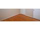 A bright bedroom features hardwood flooring and a closet at 8750 Rutgers St, Westminster, CO 80031