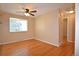Cozy bedroom featuring gleaming hardwood floors, ample natural light, and neutral wall color at 8750 Rutgers St, Westminster, CO 80031