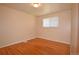 A bright bedroom showcases hardwood flooring and a window at 8750 Rutgers St, Westminster, CO 80031