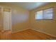 A bright bedroom showcases hardwood flooring and a window at 8750 Rutgers St, Westminster, CO 80031
