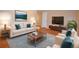 Stylishly furnished living room with hardwood floors, perfect for relaxation and entertaining at 8750 Rutgers St, Westminster, CO 80031