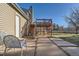 Backyard with patio, deck, and grassy area at 9150 W Bellwood Pl, Littleton, CO 80123