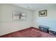 Small bedroom with window and storage container at 9150 W Bellwood Pl, Littleton, CO 80123