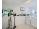 Laundry room with washer, dryer, and ample storage shelving at 9150 W Bellwood Pl, Littleton, CO 80123