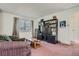 Living room with sofa, coffee table, and built-in shelving at 9150 W Bellwood Pl, Littleton, CO 80123