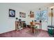 Home office space with a wooden desk, chair, and built-in shelving at 9150 W Bellwood Pl, Littleton, CO 80123