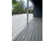 Painted deck with new looking surface with wood grain texture and covered from sunlight at 1158 E Easter Ct, Centennial, CO 80122