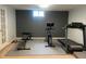 Finished basement featuring a home gym with workout equipment, padded flooring, and a window at 1158 E Easter Ct, Centennial, CO 80122