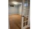 Finished basement featuring neutral carpeting, recessed lighting, and glass paneled french doors at 1158 E Easter Ct, Centennial, CO 80122