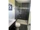 Updated bathroom featuring modern tile, a glass shower enclosure, and stylish fixtures at 1158 E Easter Ct, Centennial, CO 80122