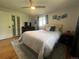 Cozy bedroom with a plush bed, decorative artwork, and ample natural light at 1158 E Easter Ct, Centennial, CO 80122