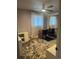 Bedroom with carpeted floors, bright windows, and ample closet space at 1158 E Easter Ct, Centennial, CO 80122