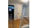 Hallway with hardwood floors, freshly painted walls, and modern fixtures at 1158 E Easter Ct, Centennial, CO 80122
