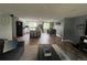 Open concept living space with a modern kitchen, dining area, and comfortable seating at 1158 E Easter Ct, Centennial, CO 80122