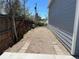 Narrow side yard with gravel and brick pathways at 1158 E Easter Ct, Centennial, CO 80122