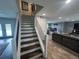 Modern stairway connecting the living spaces, featuring an open design and natural light at 1158 E Easter Ct, Centennial, CO 80122