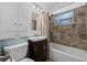 Cozy bathroom with a stylish vanity and shower-tub combination at 3960 Cody St, Wheat Ridge, CO 80033