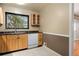 Kitchen featuring wood cabinets, stainless steel appliances, and a window above the sink at 3960 Cody St, Wheat Ridge, CO 80033