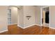 Open living space with gleaming hardwood floors and an arched opening to another room at 3960 Cody St, Wheat Ridge, CO 80033