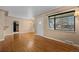 Inviting living room showcasing gleaming hardwood floors, abundant natural light, and neutral paint at 3960 Cody St, Wheat Ridge, CO 80033