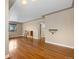 Spacious living room with polished wood floors, neutral walls, and an arched doorway at 3960 Cody St, Wheat Ridge, CO 80033