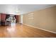 The living room features hardwood floors, a sliding glass door, and a cozy leather chair at 3960 Cody St, Wheat Ridge, CO 80033