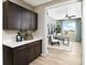 Functional office space with built-in cabinets, a workspace, and natural light at 9192 Telluride Ct, Commerce City, CO 80022