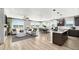 Spacious open floorplan with a living room, dining area, and kitchen with lots of natural light at 9192 Telluride Ct, Commerce City, CO 80022