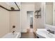 Bathroom with white ceramic sink and updated shower-tub combination at 3726 N High St, Denver, CO 80205