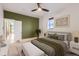 Comfortable bedroom featuring a ceiling fan, soft carpet, and an olive-green accent wall at 3726 N High St, Denver, CO 80205