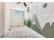 Bedroom featuring a painted mountain mural at 3726 N High St, Denver, CO 80205