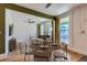 Dining area featuring an open floorplan with hardwood floors and lots of light at 3726 N High St, Denver, CO 80205